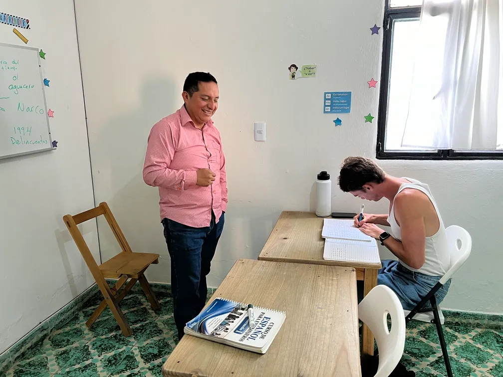 Spanish teacher explaining grammar at SanCris